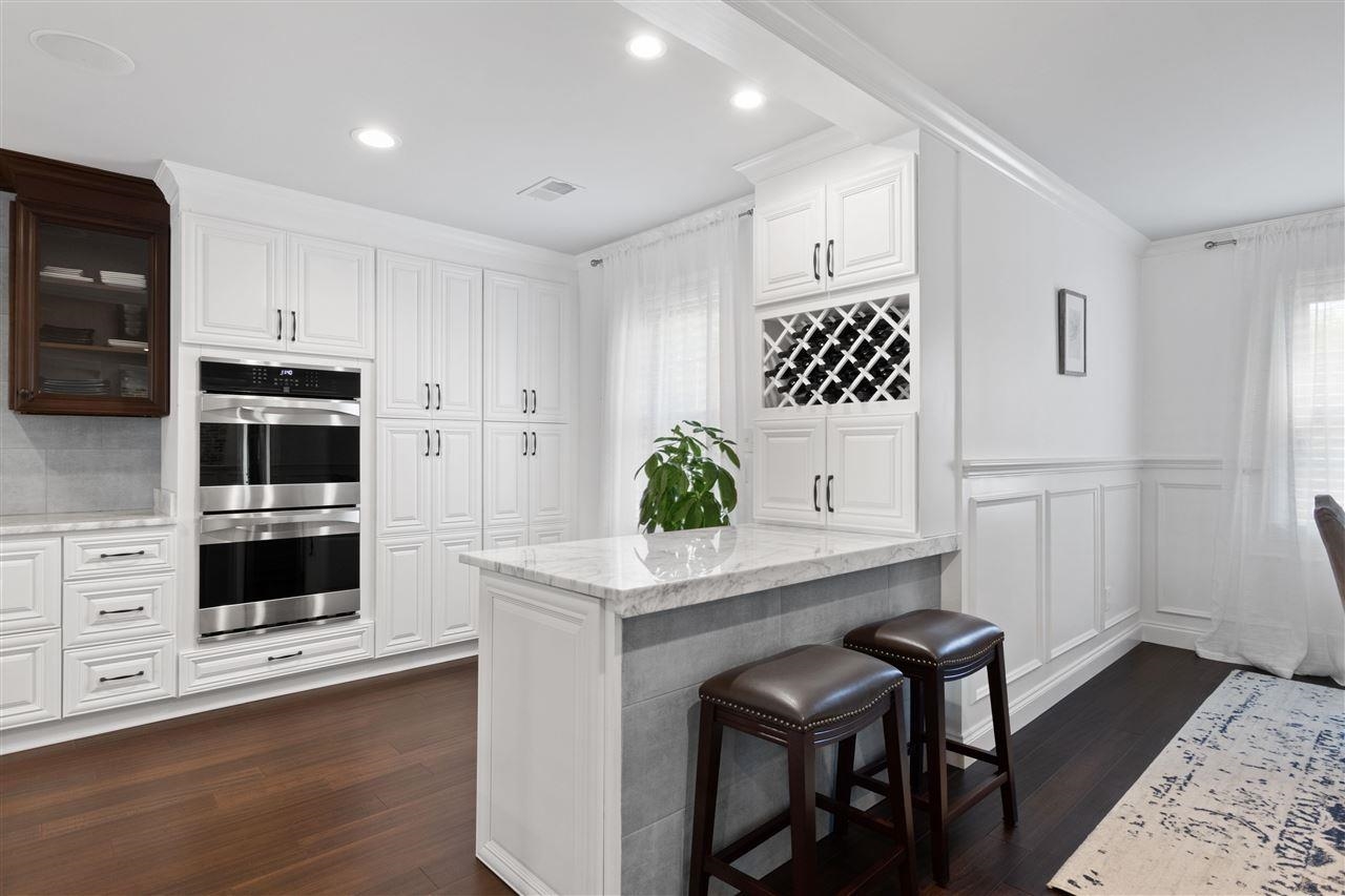 1911 Brierbrook Road Germantown, TN 38138 - Photo 8 of 26 a kitchen with stainless steel appliances a stove a microwave a sink and cabinets