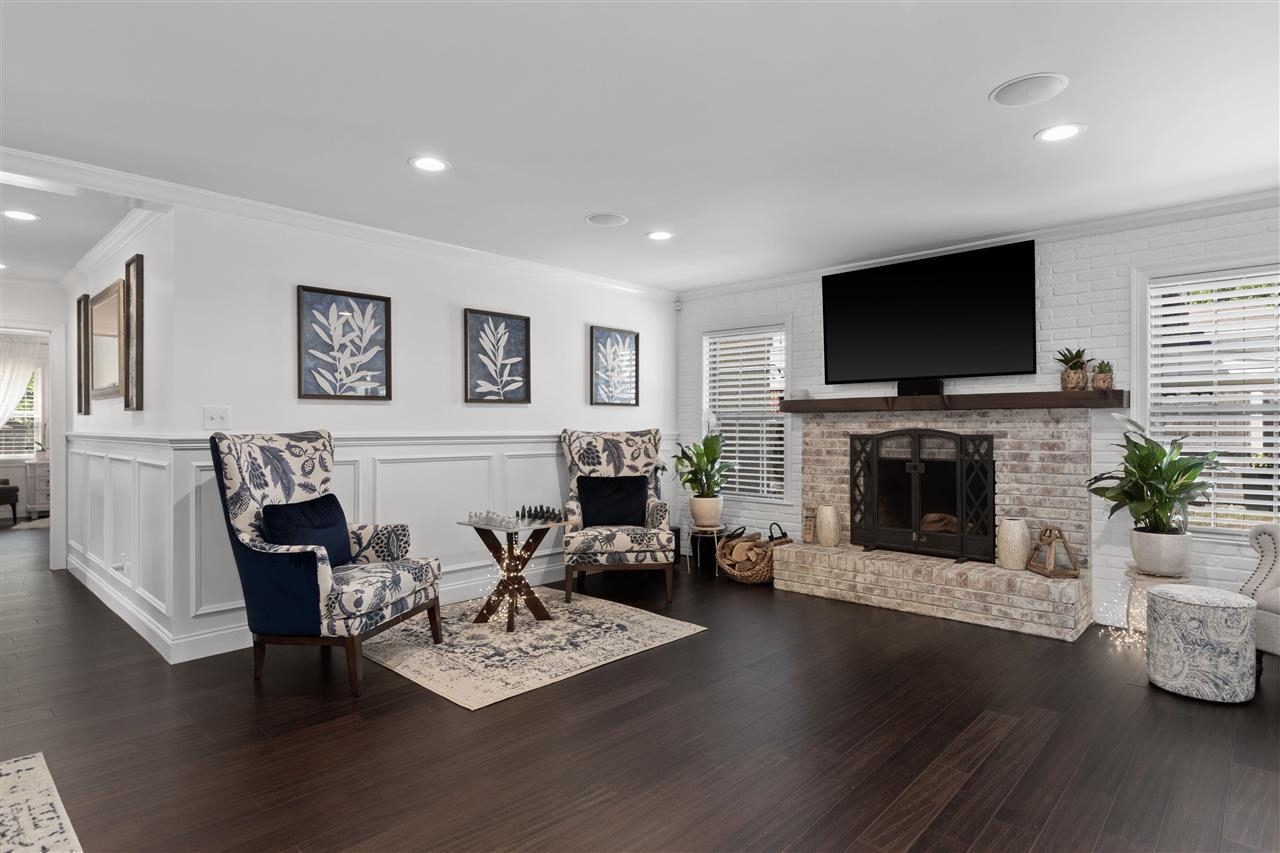 1911 Brierbrook Road Germantown, TN 38138 - Photo 10 of 26 a living room with furniture a fireplace a flat screen tv and a fireplace