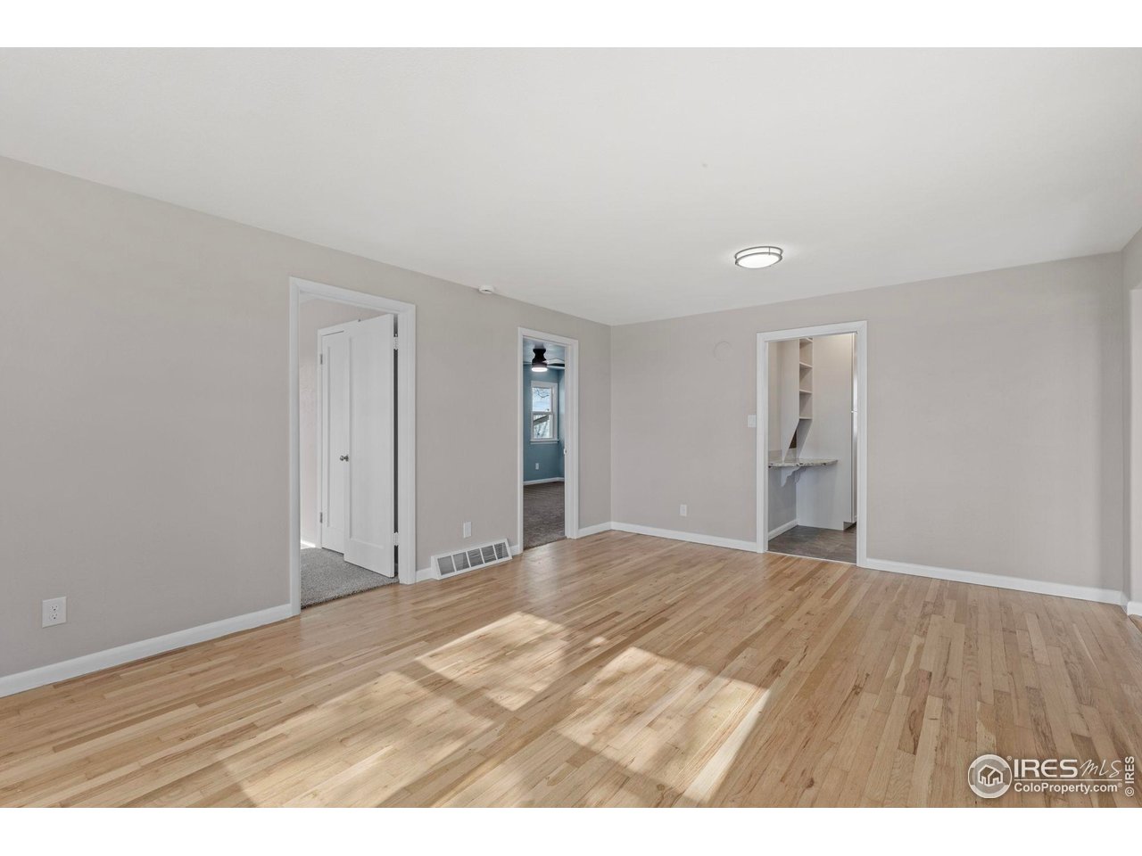 17217 County Road 86 Pierce, CO 80650 - Photo 14 of 49 a view of an empty room with wooden floor