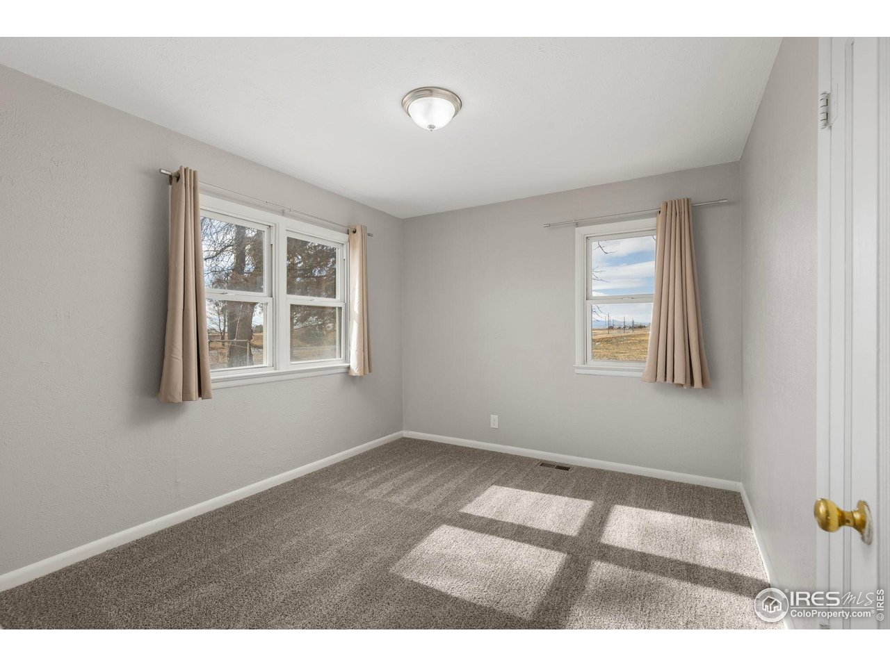 17217 County Road 86 Pierce, CO 80650 - Photo 19 of 49 a view of an empty room with a window