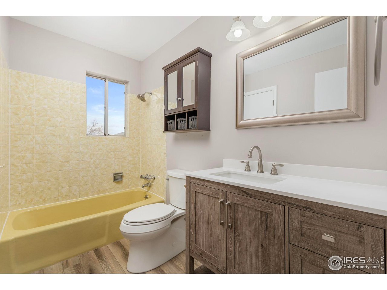 17217 County Road 86 Pierce, CO 80650 - Photo 24 of 49 a bathroom with a granite countertop toilet a sink a mirror and a bathtub