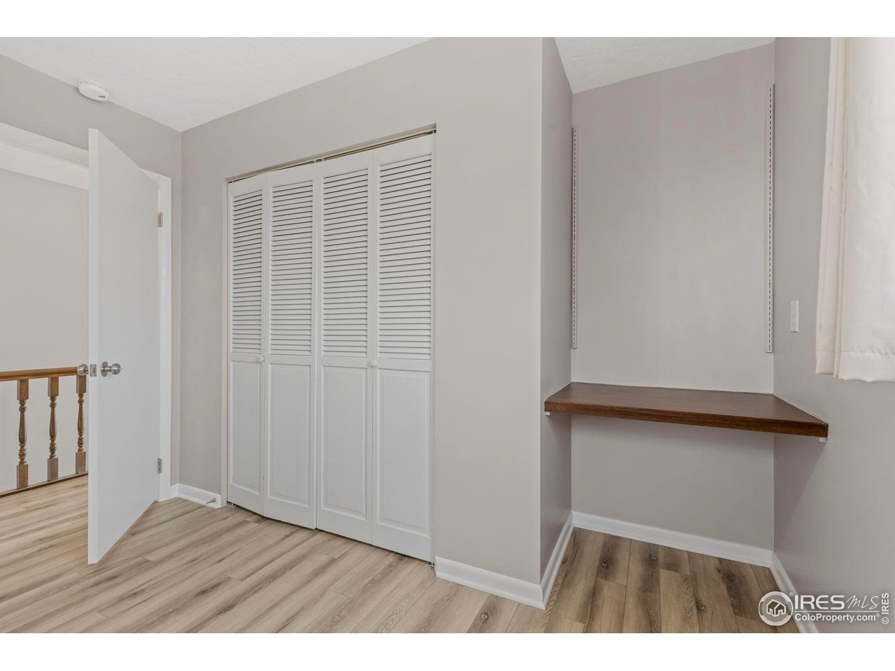 17217 County Road 86 Pierce, CO 80650 - Photo 28 of 49 a view of an empty room with wooden floor