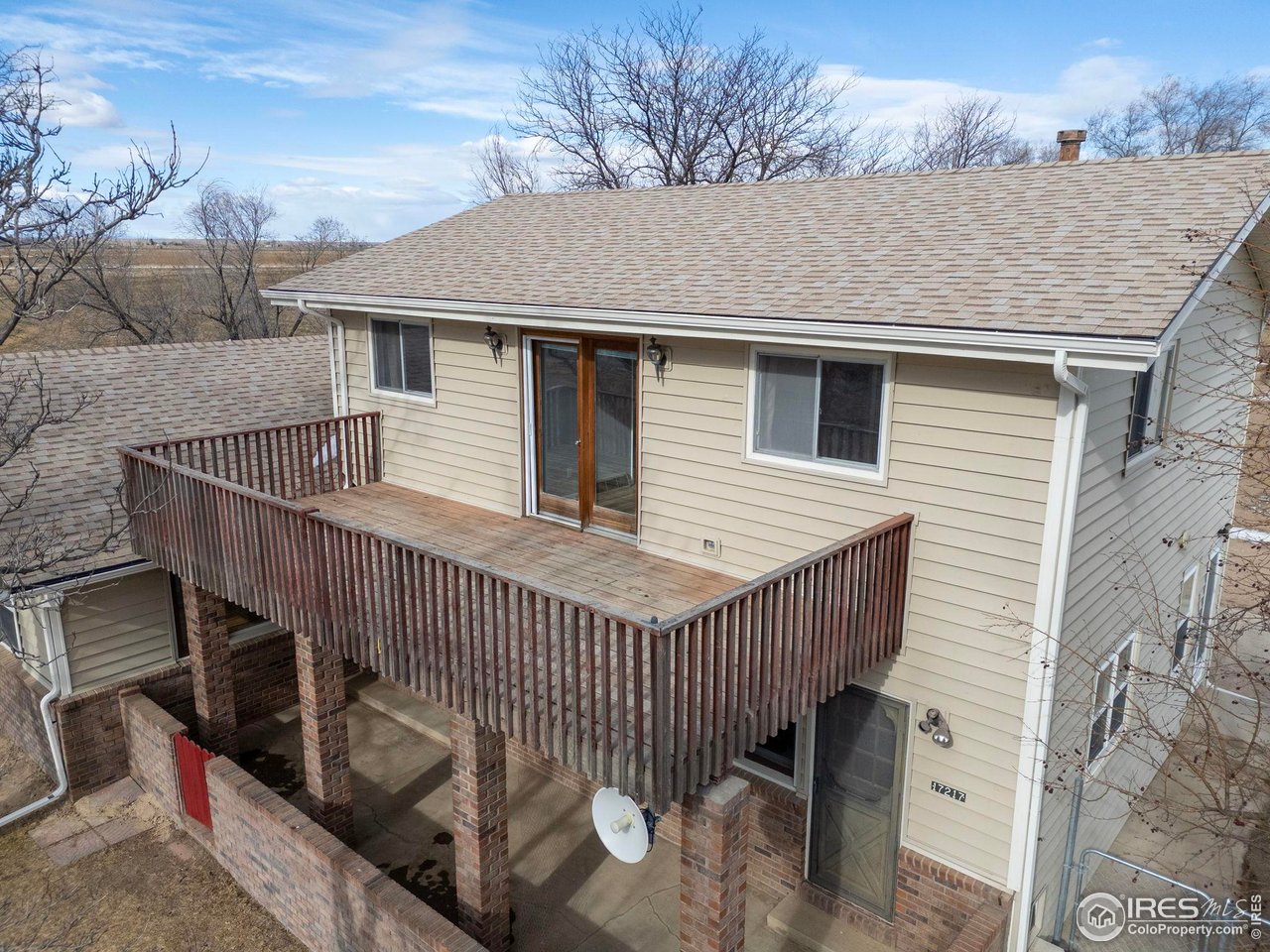 17217 County Road 86 Pierce, CO 80650 - Photo 31 of 49 a view of a house with wooden deck and furniture