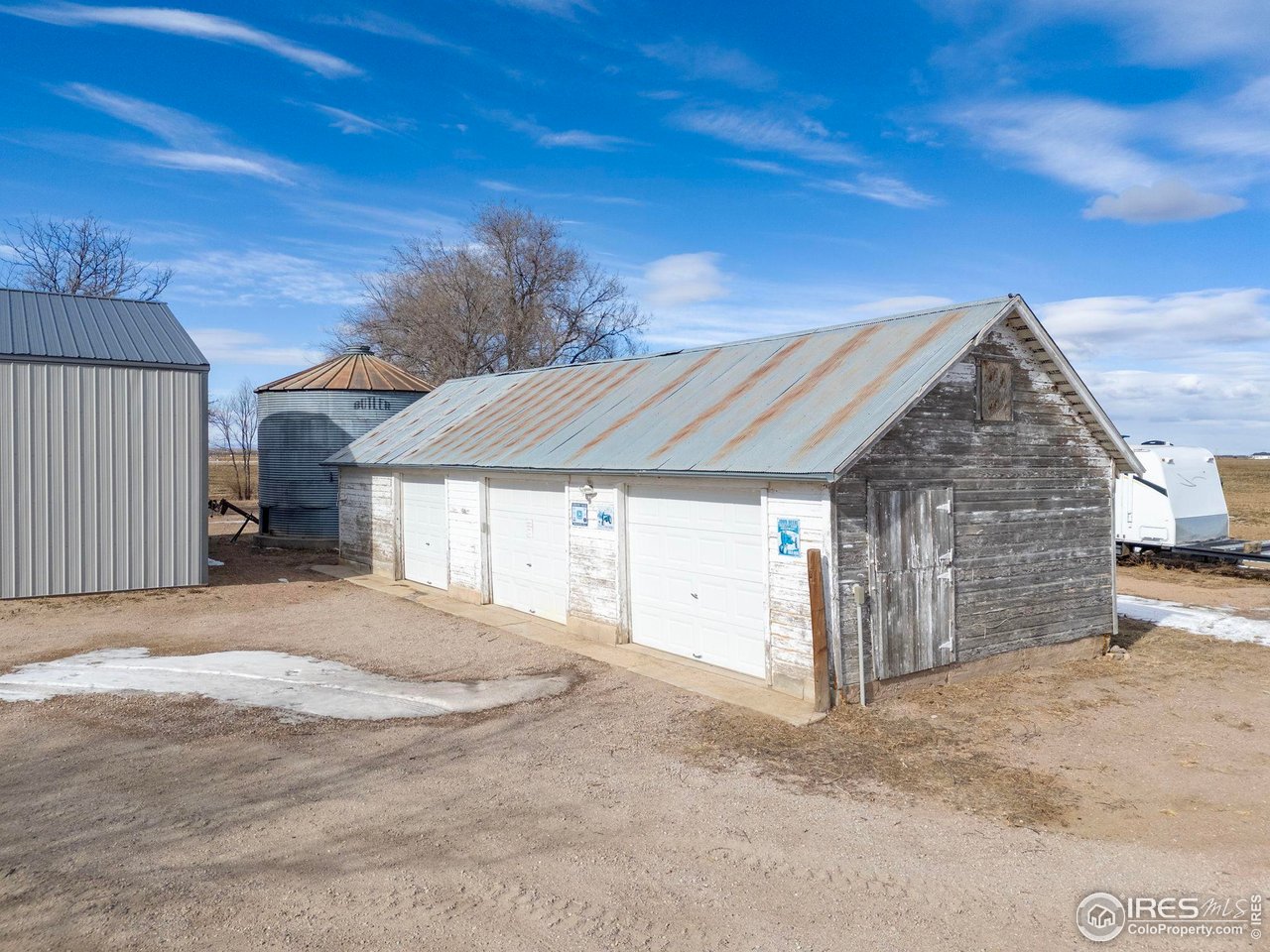 17217 County Road 86 Pierce, CO 80650 - Photo 40 of 49 a view of a house with a backyard