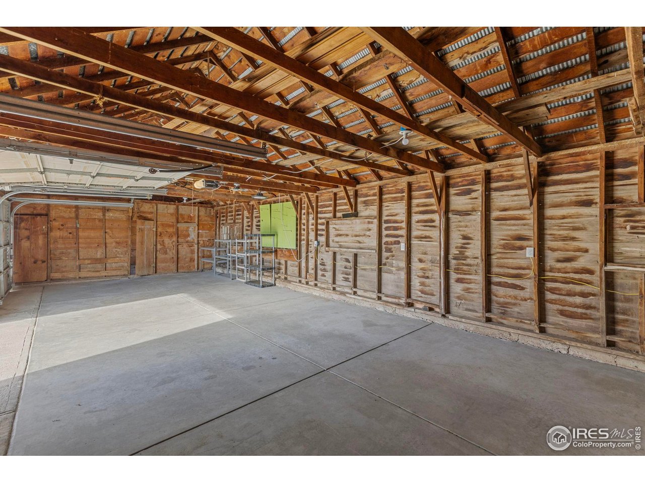 17217 County Road 86 Pierce, CO 80650 - Photo 41 of 49 a view of an empty room with wooden walls