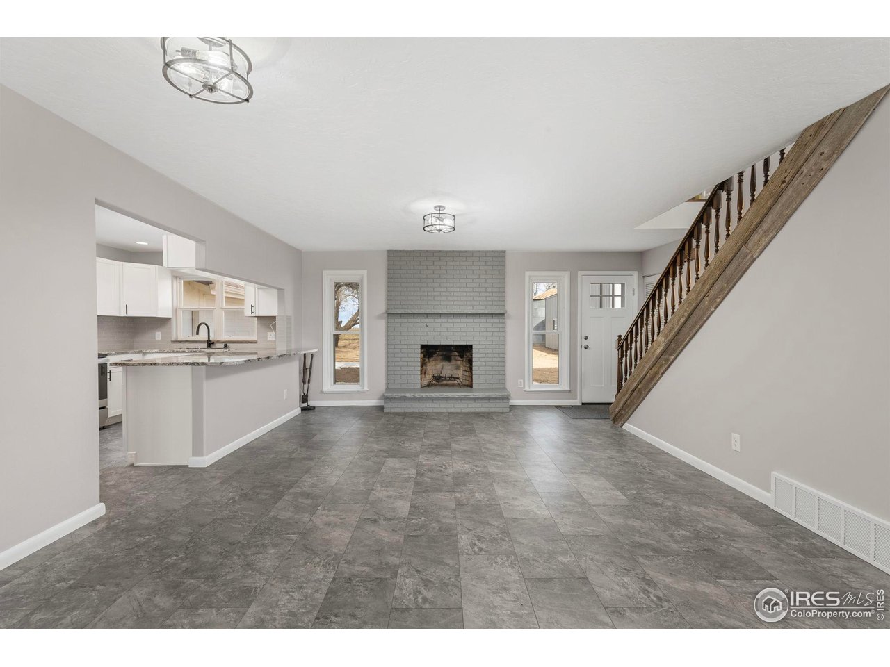 17217 County Road 86 Pierce, CO 80650 - Photo 6 of 49 a view of kitchen and window with fireplace