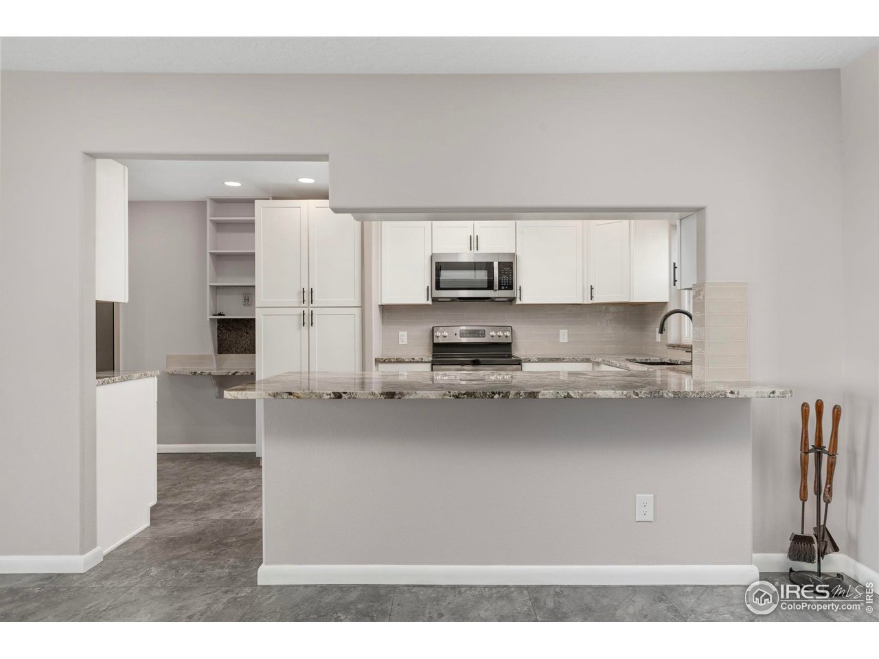 17217 County Road 86 Pierce, CO 80650 - Photo 9 of 49 a kitchen with stainless steel appliances a sink stove and refrigerator