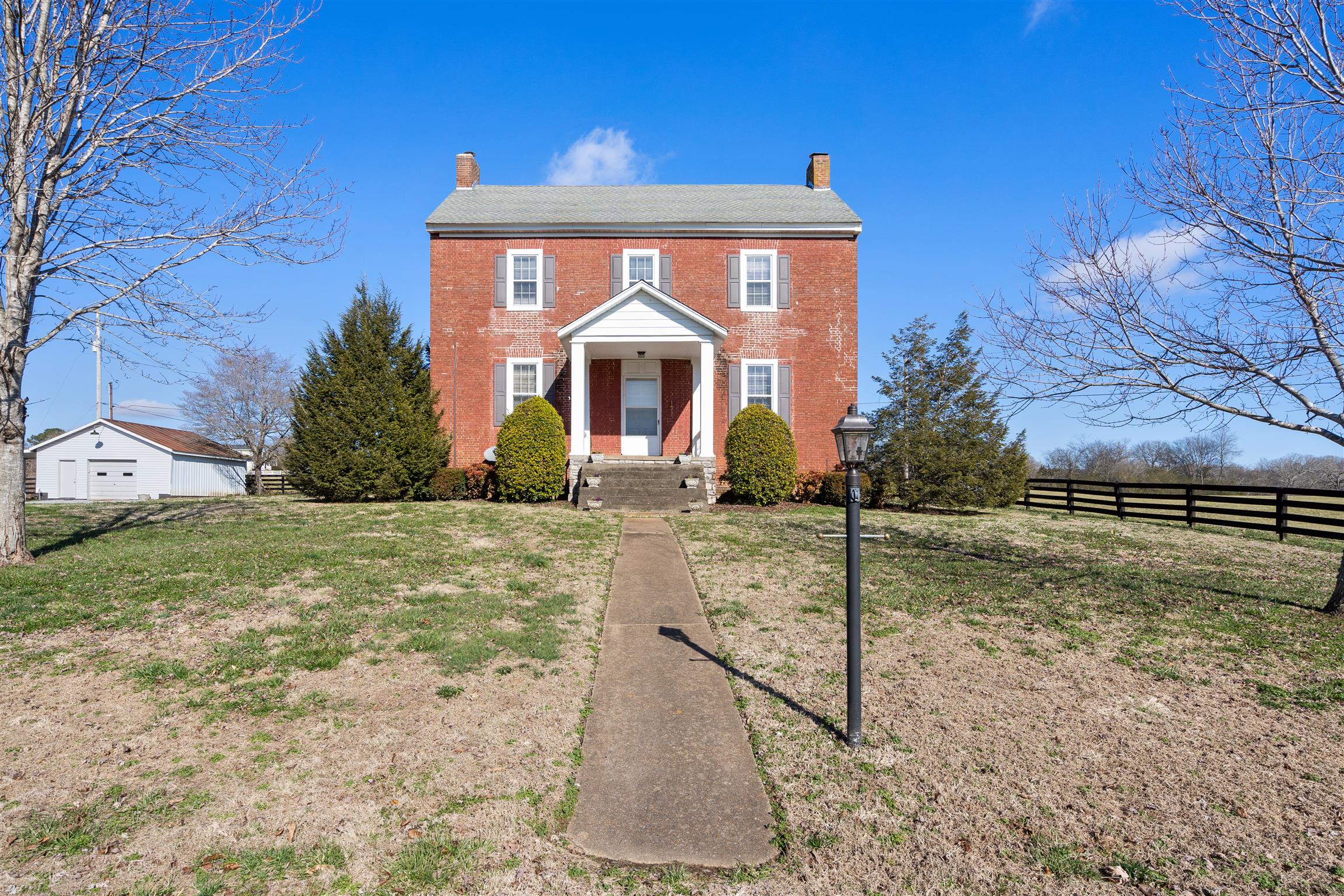 3248 Marthas Chapel Road Cunningham, TN 37052 - Photo 1 of 30 a front view of a house with garden