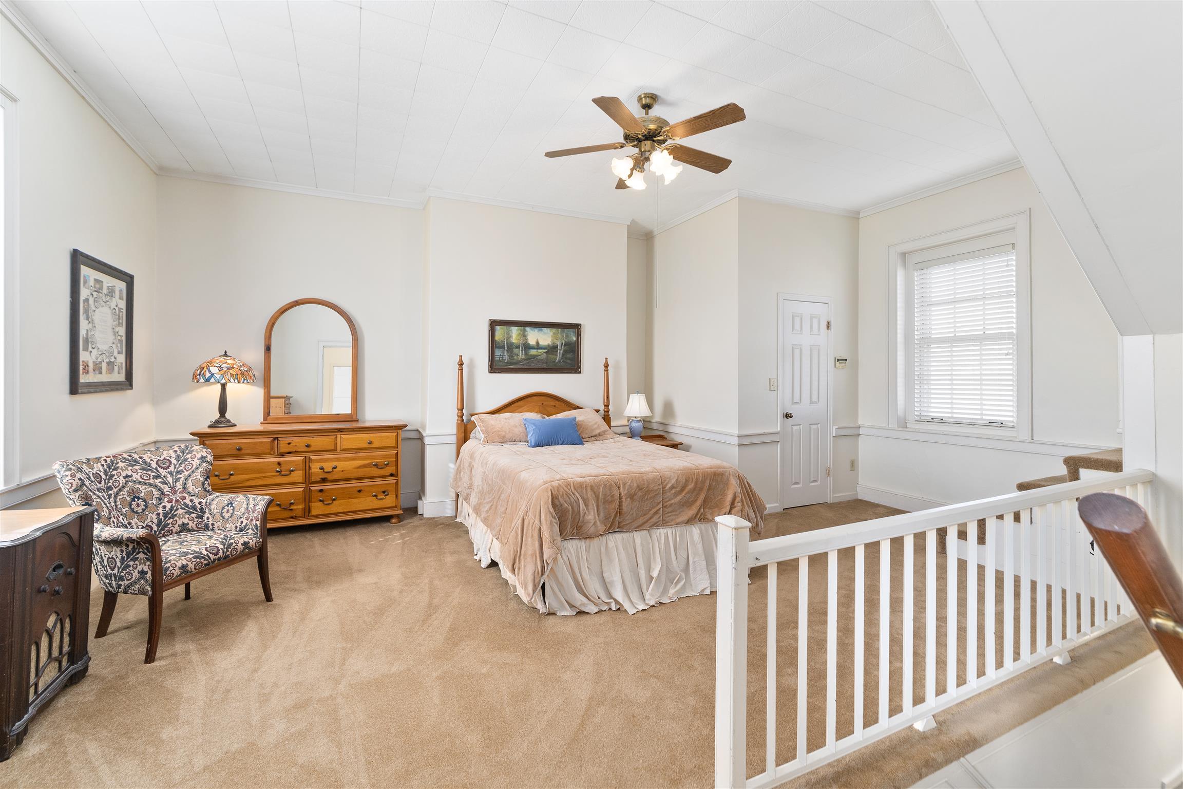 3248 Marthas Chapel Road Cunningham, TN 37052 - Photo 12 of 30 a bedroom with a bed and a dresser with the outer view