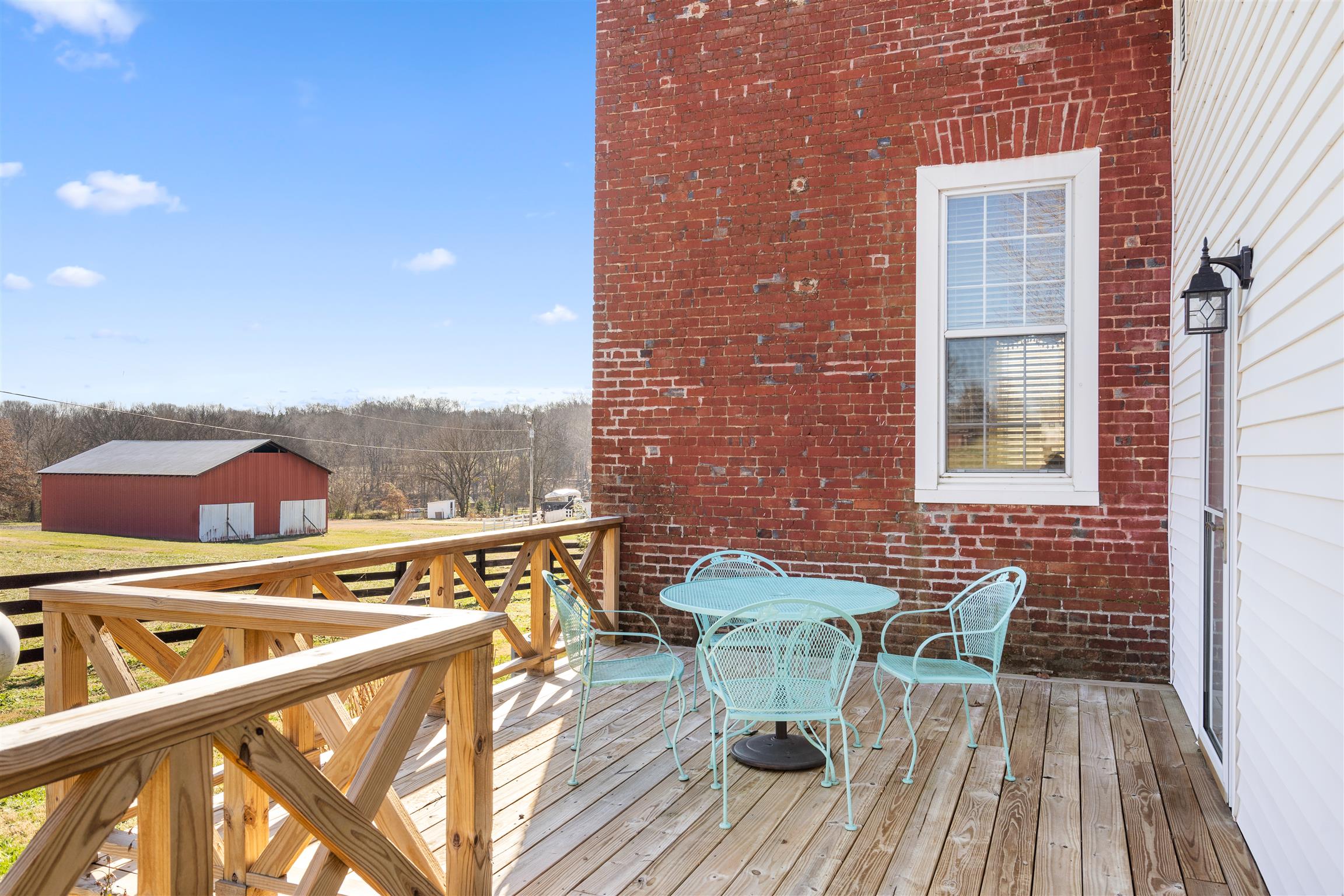 3248 Marthas Chapel Road Cunningham, TN 37052 - Photo 23 of 30 a view of a balcony with table and chairs