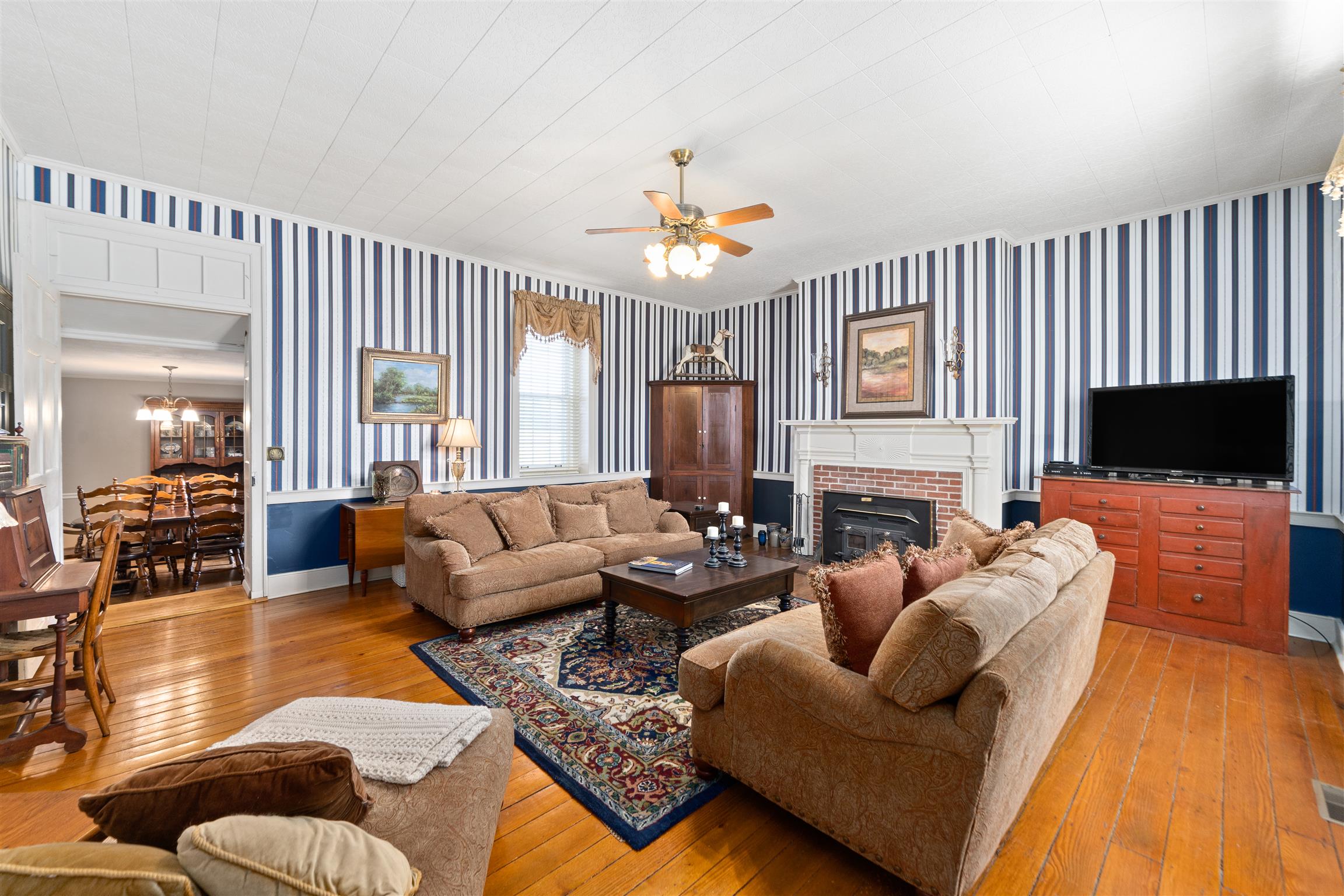 3248 Marthas Chapel Road Cunningham, TN 37052 - Photo 6 of 30 a living room with furniture fireplace and a flat screen tv