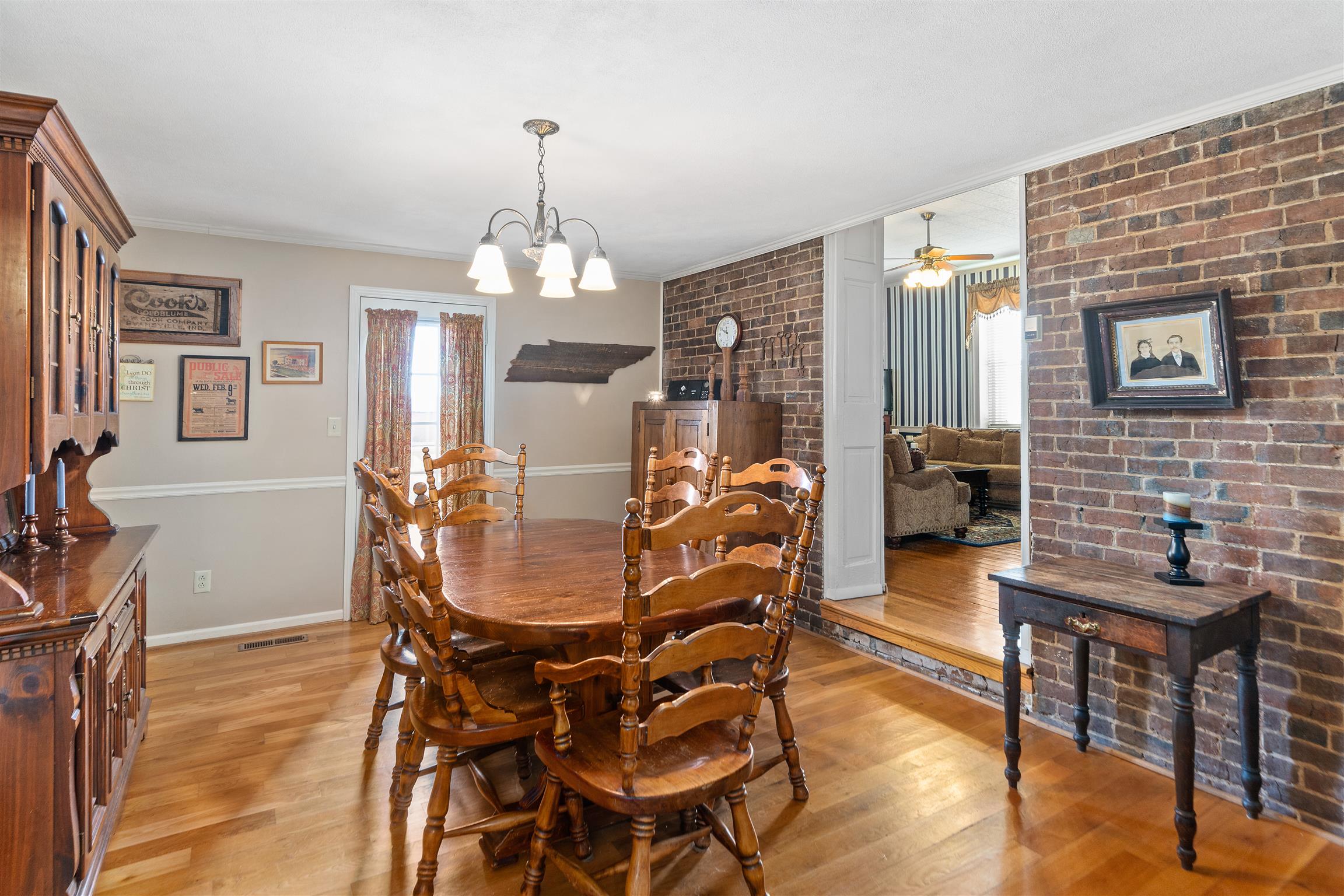 3248 Marthas Chapel Road Cunningham, TN 37052 - Photo 7 of 30 a dining room with furniture a chandelier and wooden floor