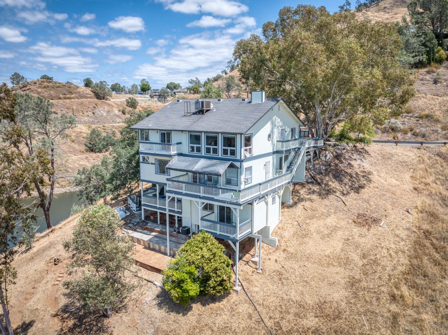 28037 Sky Harbour Road Friant, CA 93626 - Photo 2 of 40 a front view of a house with a yard