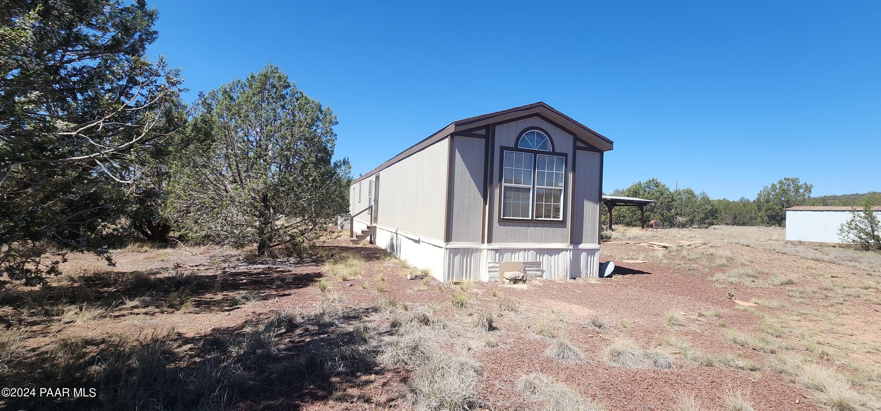 1159 Foothill Road Williams, AZ 86046 - Photo 3 of 31 a house view with a outdoor space