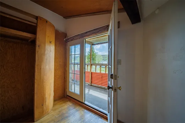 a view of front door with wooden floor