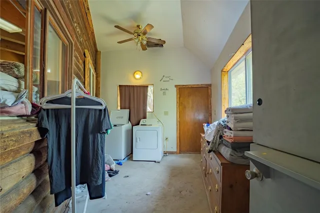 a view of a livingroom with furniture and chandelier