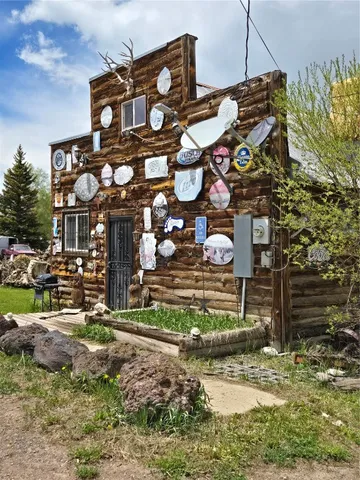 a view of a street with potted plants
