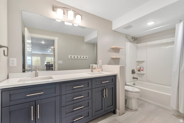 3232 West 1670th Street North Provo, UT 84601 - Photo 25 of 33 Bathroom with double vanity, shower / bath combo with shower curtain, recessed lighting, and ensuite bath