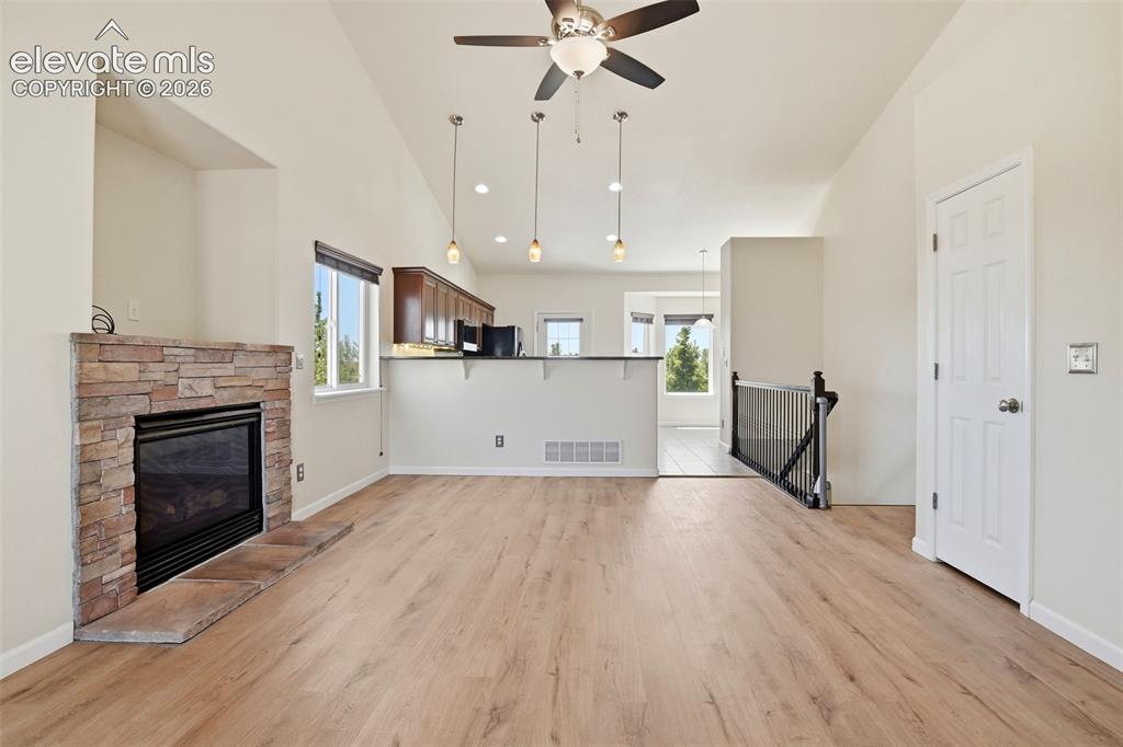 7806 Dutch Loop Colorado Springs, CO 80925 - Photo 4 of 41 a view of kitchen with cabinets and wooden floor