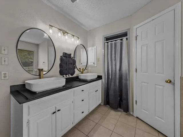 a bathroom with a tub and a shower