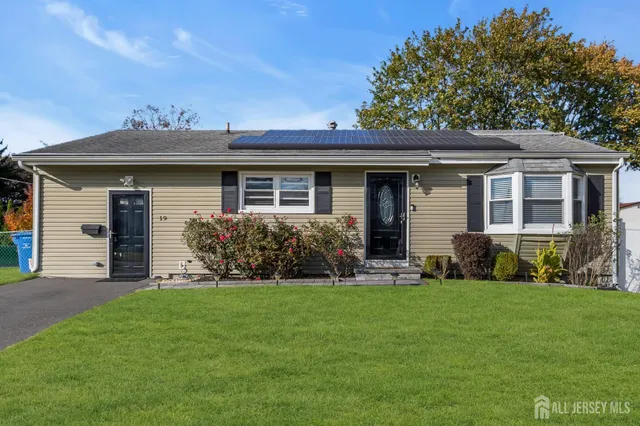 a view of a house with a yard and plants