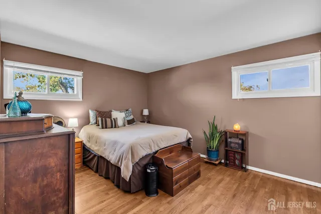 a bedroom with a bed and a table