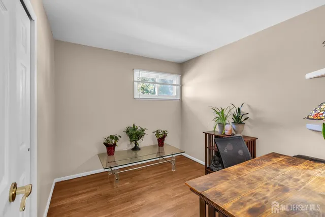 a room with a table and chairs