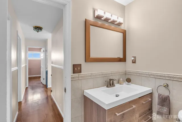 a bathroom with a sink a mirror and a shower