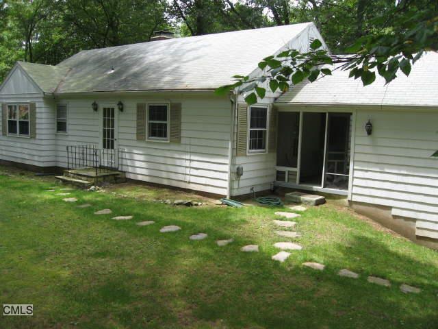 37 Blueberry Hill Road Weston, CT 06883 - Photo 1 of 1 a view of a house with a garden