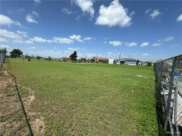 a view of a golf course with an trees