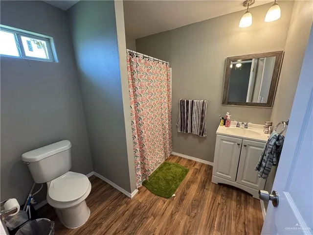 a bathroom with a toilet and a sink
