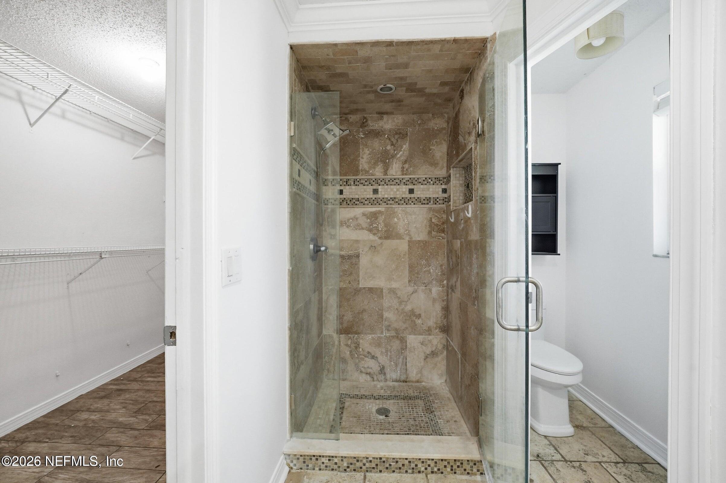 969 Alpine Ridge Court Orange Park, FL 32065 - Photo 17 of 26 a bathroom with a shower and toilet