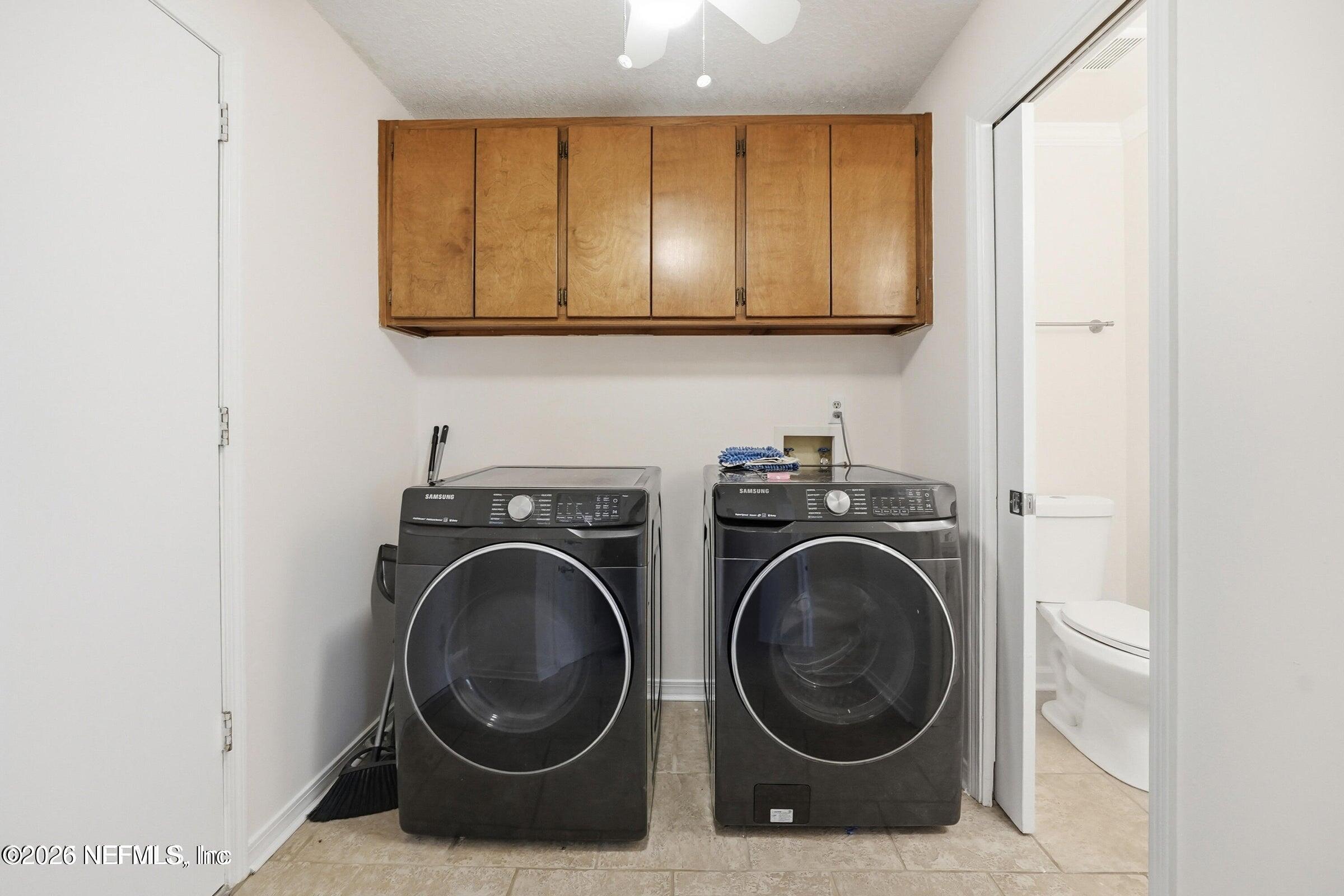 969 Alpine Ridge Court Orange Park, FL 32065 - Photo 21 of 26 a utility room with sink dryer and washer