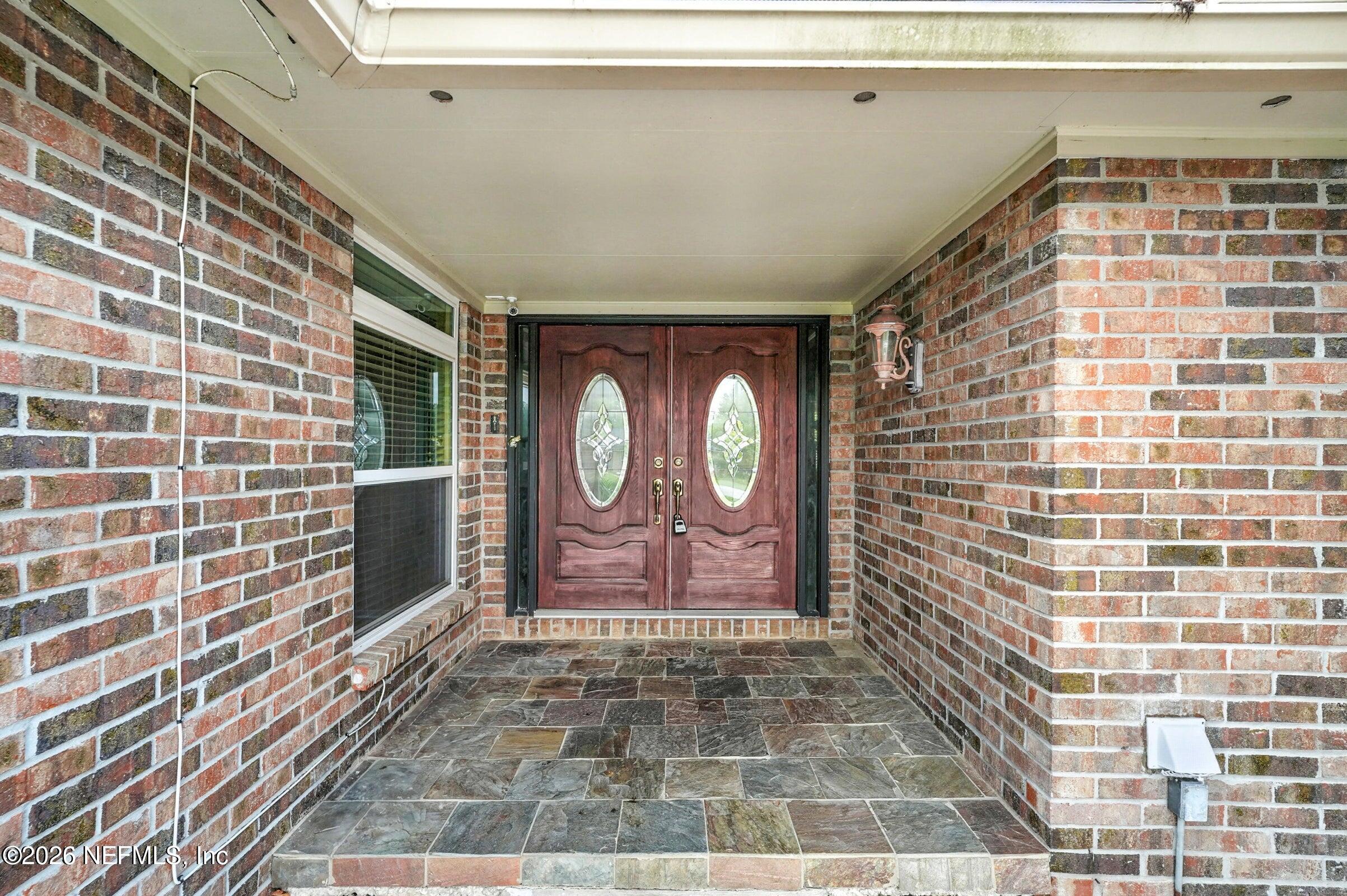 969 Alpine Ridge Court Orange Park, FL 32065 - Photo 6 of 26 a front view of a house with shower and window