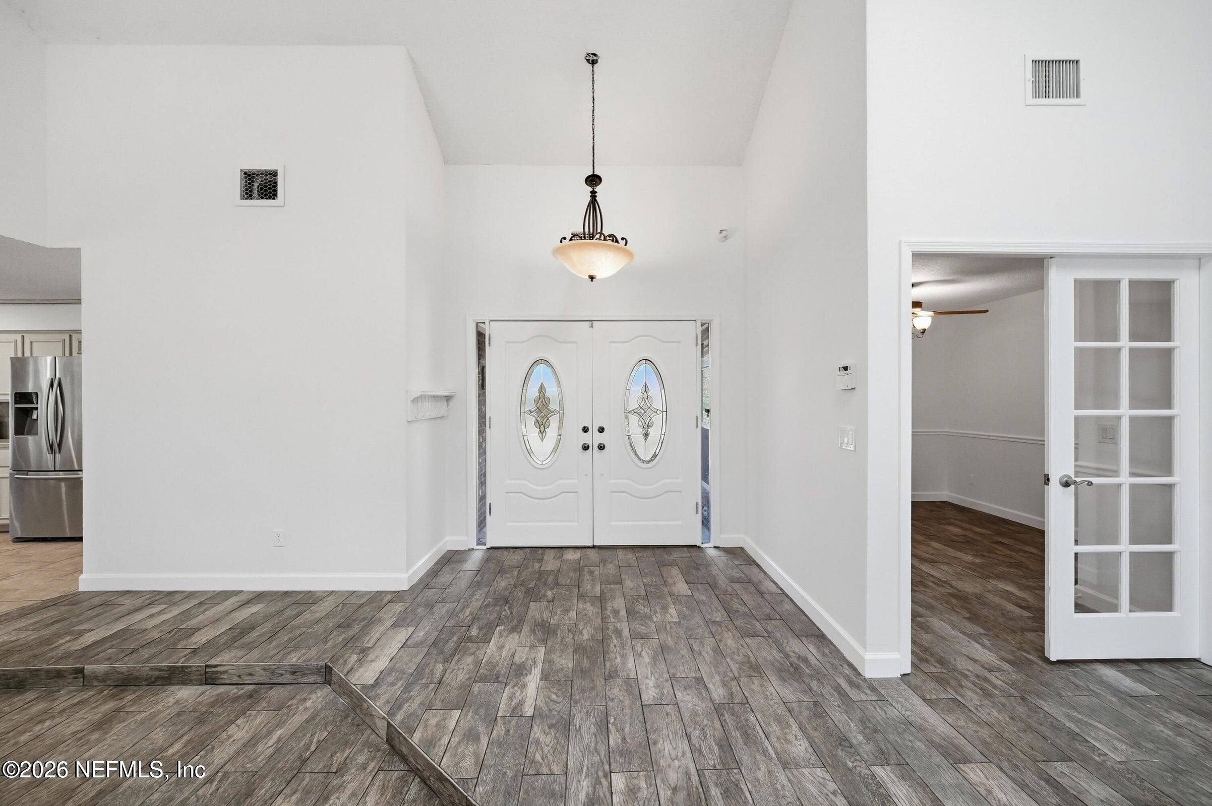 969 Alpine Ridge Court Orange Park, FL 32065 - Photo 7 of 26 a view of a room with wooden floor and window
