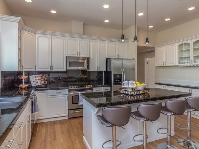 79 Del Prado Drive Campbell, CA 95008 - Photo 19 of 34 a kitchen with granite countertop a stove a sink and a microwave