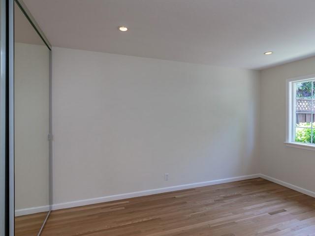79 Del Prado Drive Campbell, CA 95008 - Photo 27 of 34 a view of an empty room with wooden floor and a window