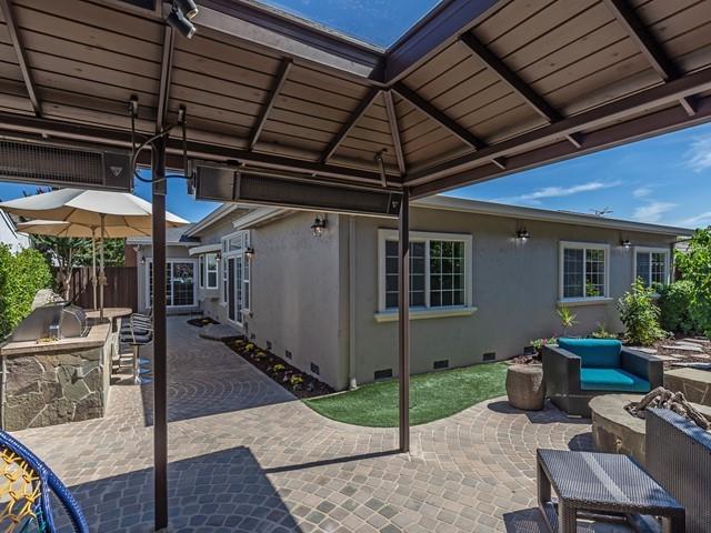 79 Del Prado Drive Campbell, CA 95008 - Photo 33 of 34 a view of a backyard with table and chairs under an umbrella