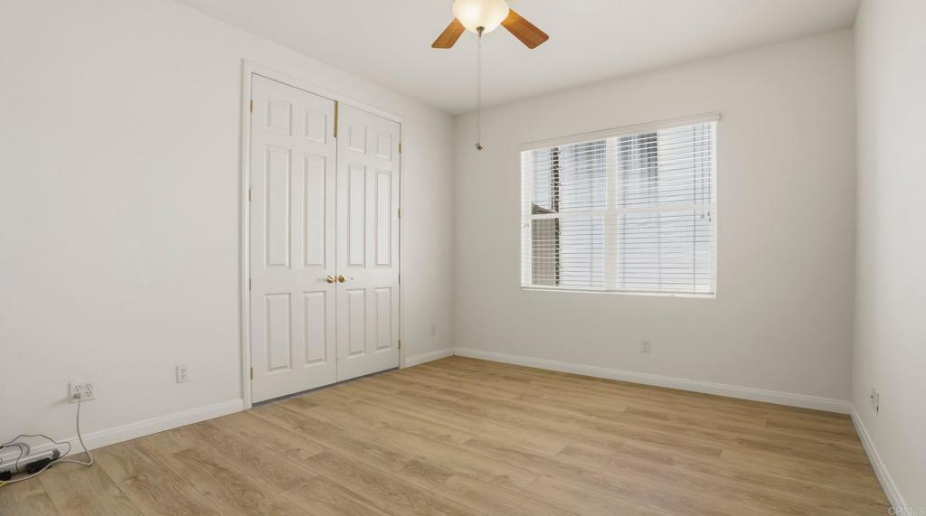 2527 Southern Oak Road Ramona, CA 92065 - Photo 30 of 56 an empty room with windows and fan