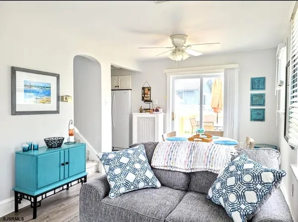 a view of a dining room with furniture and a window