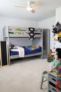 a bedroom with bed and window