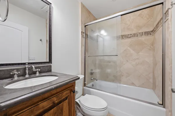 a bathroom with a tub and window