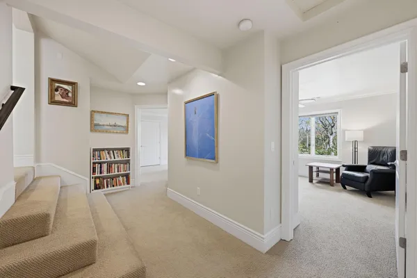a view of a swimming pool with sitting area