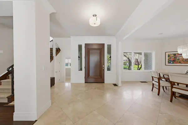 a dining room with furniture and window