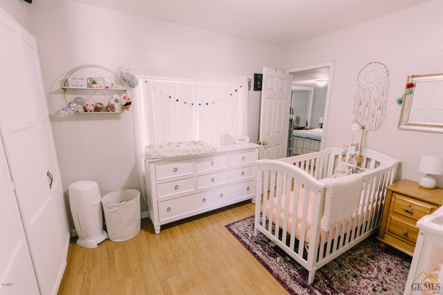 424 West Cedar Street Oxnard, CA 93033 - Photo 13 of 26 a bedroom with furniture and baby crib