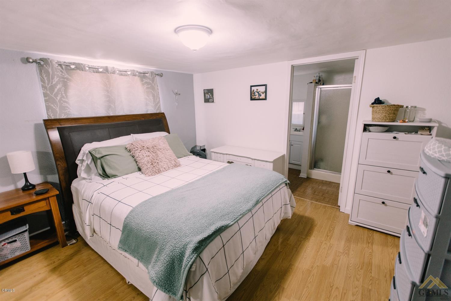 424 West Cedar Street Oxnard, CA 93033 - Photo 18 of 26 a bed room with a bed and a tv