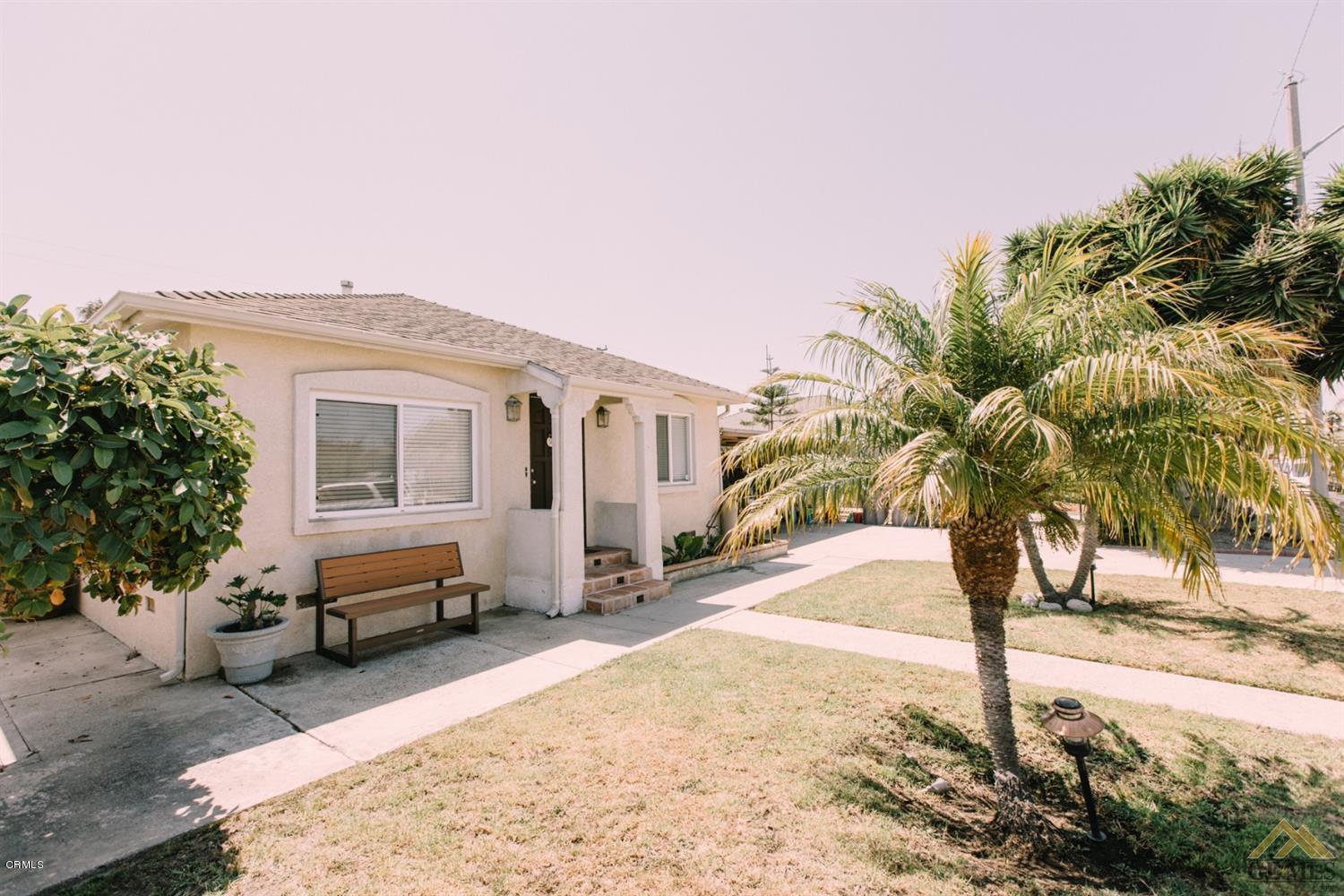 424 West Cedar Street Oxnard, CA 93033 - Photo 3 of 26 a view of a yard with car parked