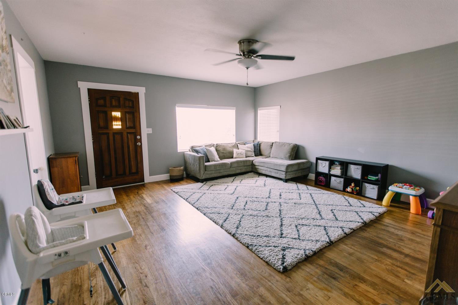 424 West Cedar Street Oxnard, CA 93033 - Photo 8 of 26 a living room with furniture and wooden floor
