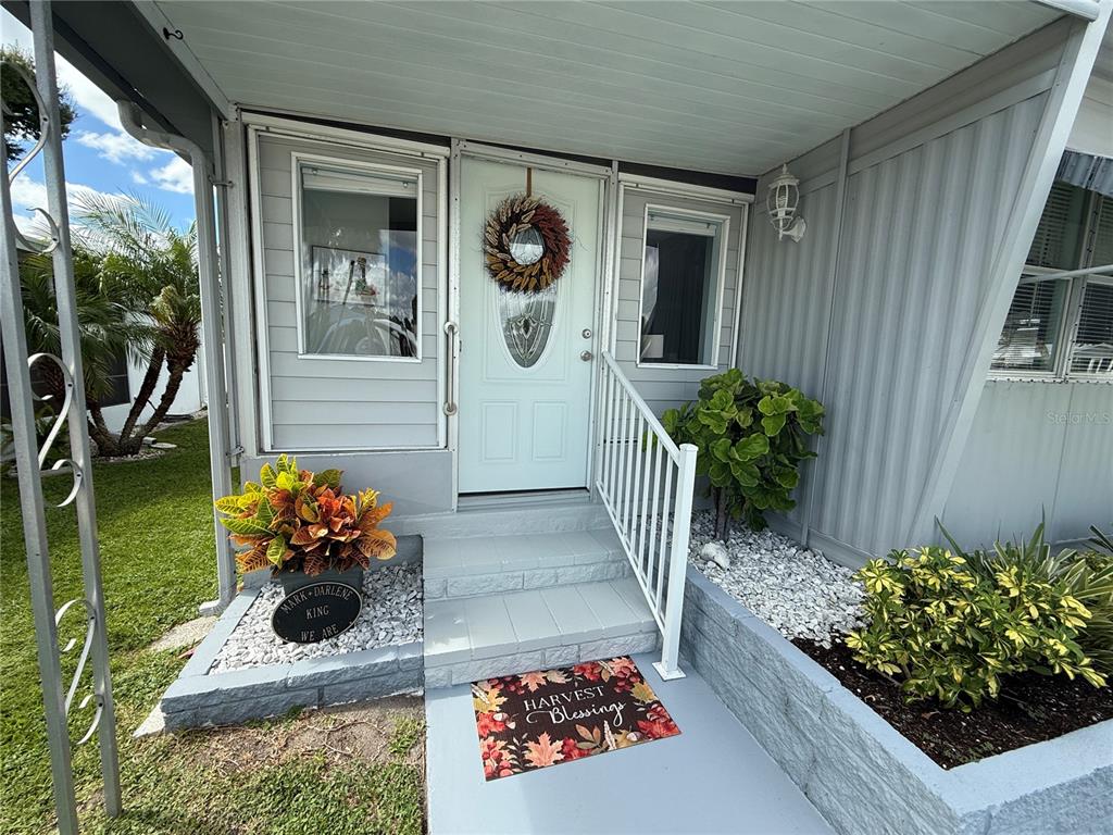 6190 Daffodil Road Venice, FL 34293 - Photo 2 of 16 a bunch of flowers in front of house