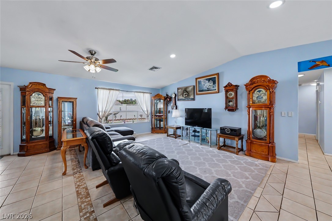 3107 Trueno Road Henderson, NV 89014 - Photo 22 of 37 A relaxed living area with ample seating and tiled flooring.